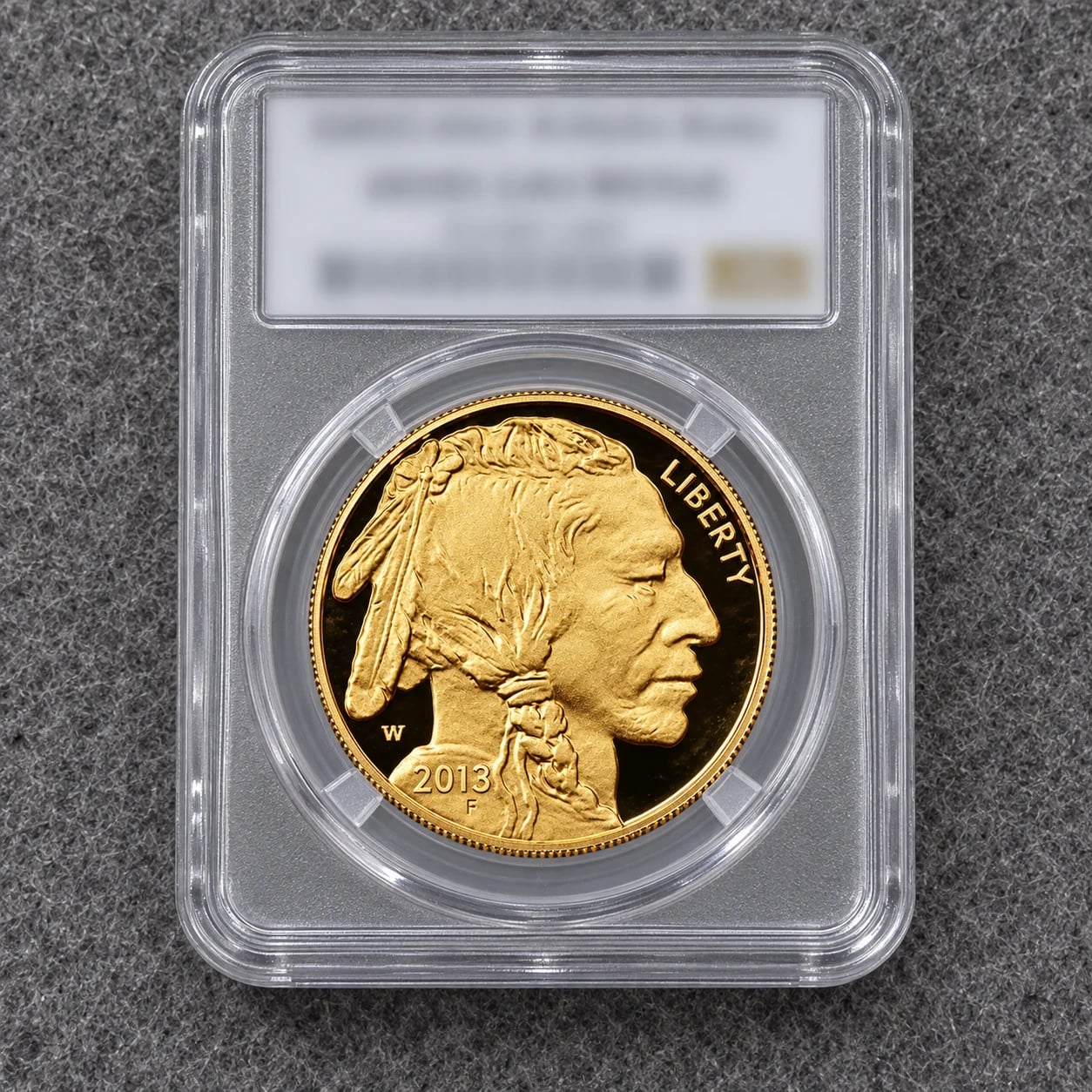 A complete one-ounce American Gold Buffalo proof coin in a professional grading holder