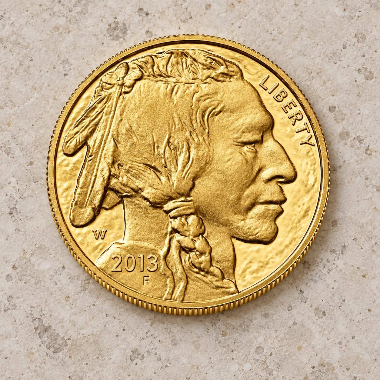 A complete modern one-ounce American Gold Buffalo coin showing the Native American portrait