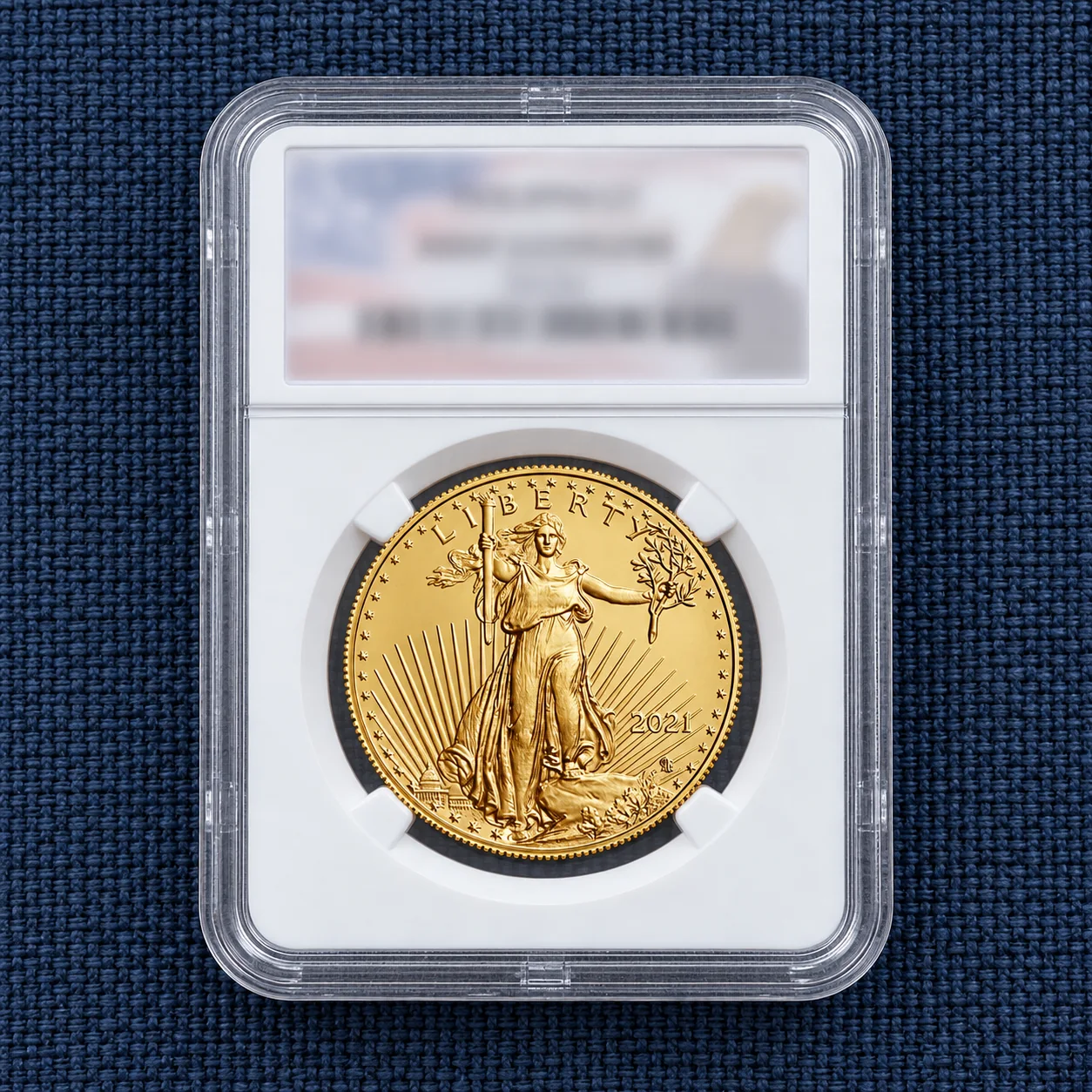 A complete one-ounce American Gold Eagle Lady Liberty coin in a professional grading holder