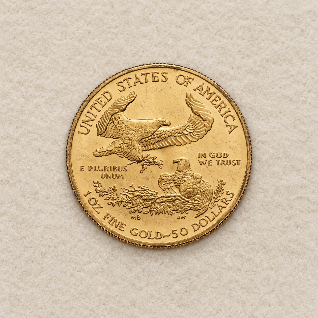 A complete older toned one-ounce American Gold Eagle coin showing the Type 1 family reverse