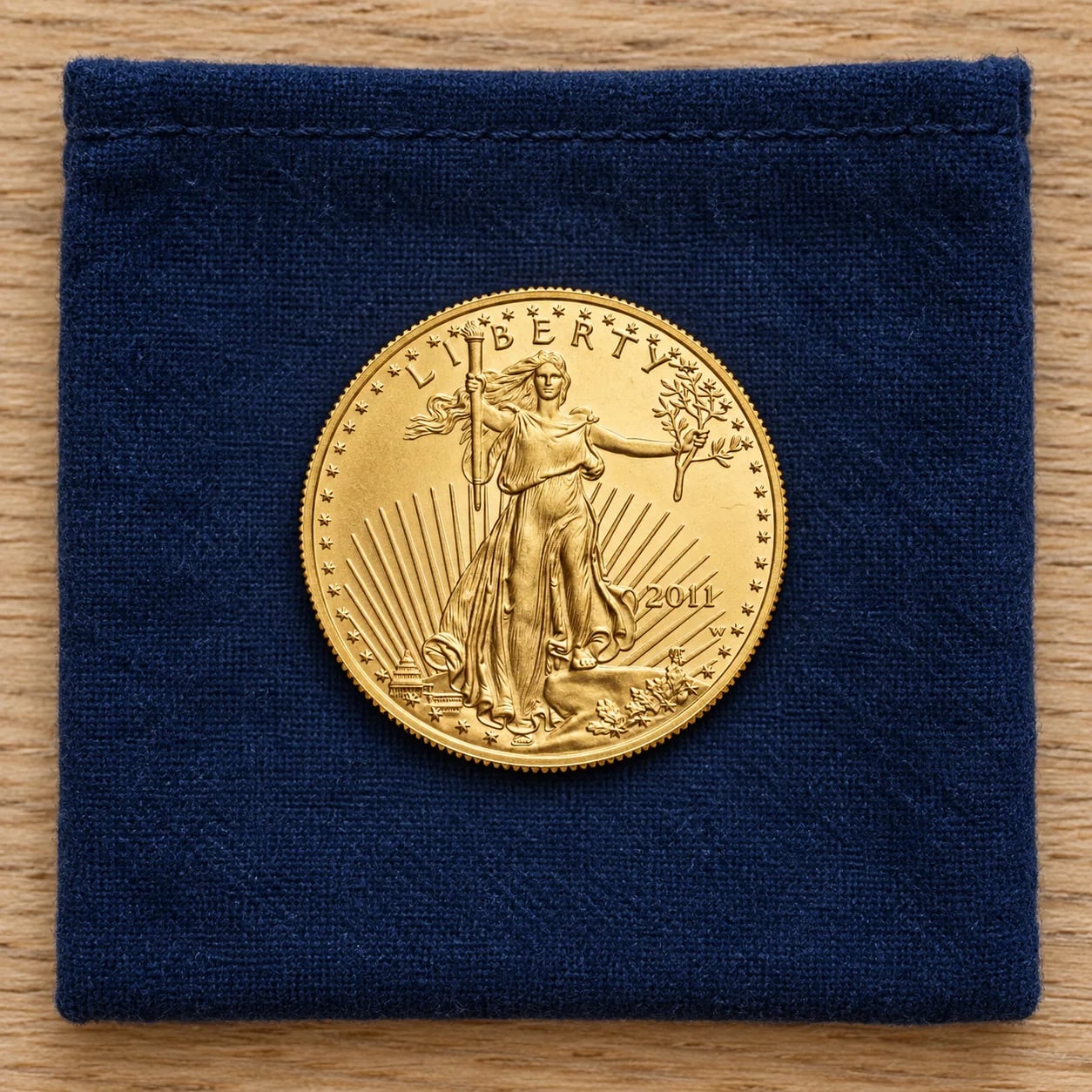 A complete satin-finish 2011 quarter-ounce American Gold Eagle coin showing Lady Liberty
