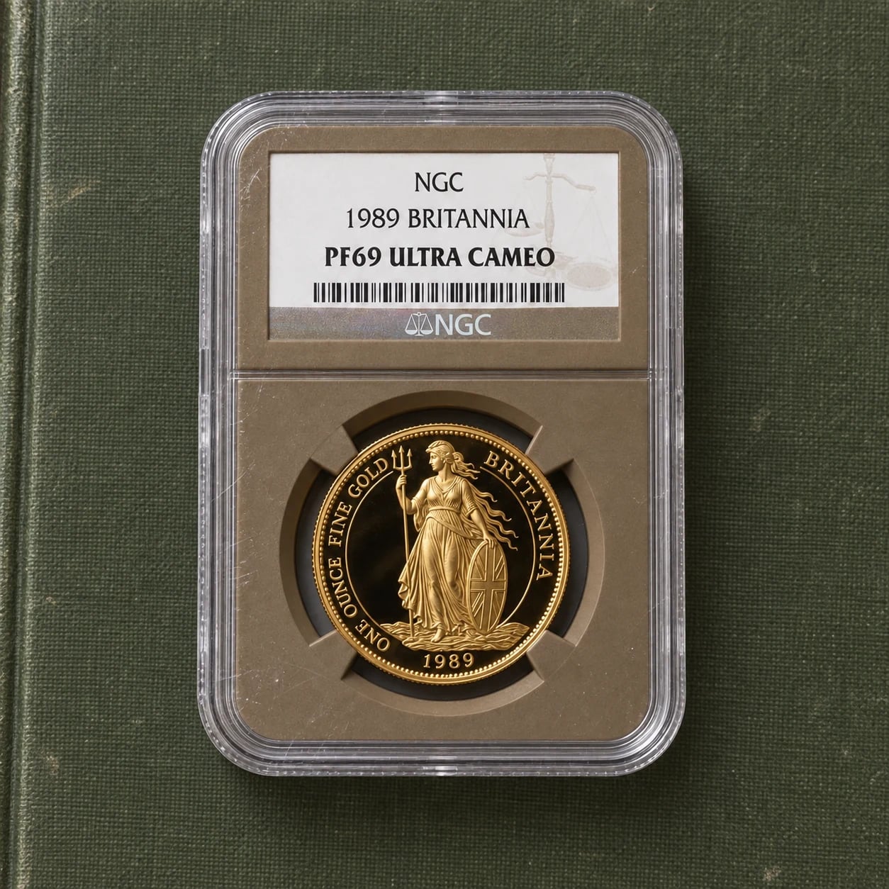 A complete 1989 proof Gold Britannia coin in an NGC PF69 Ultra Cameo holder