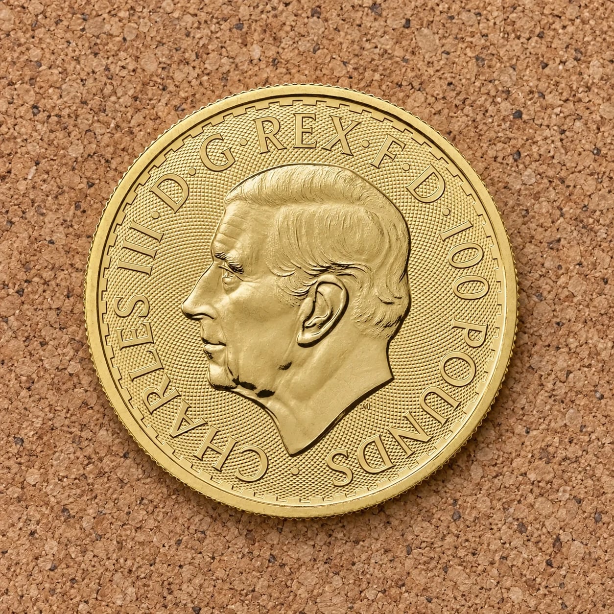 The complete Charles III portrait side of a one-ounce Gold Britannia coin