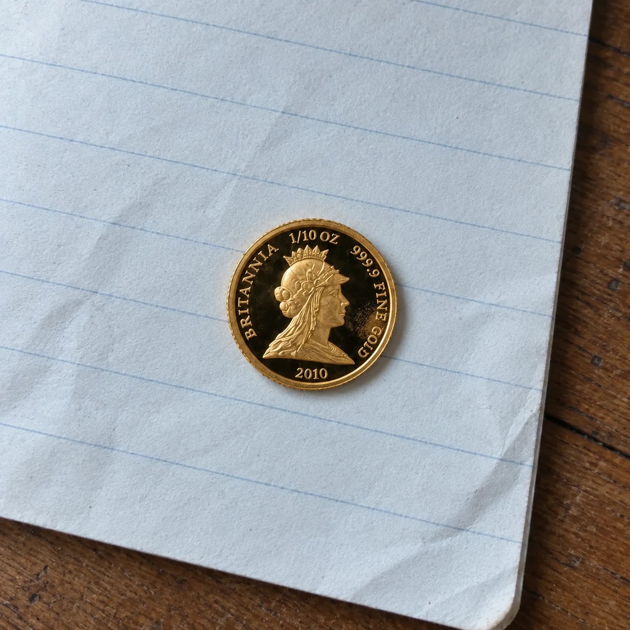 The complete Elizabeth II portrait side of a 2010 Gold Britannia proof coin
