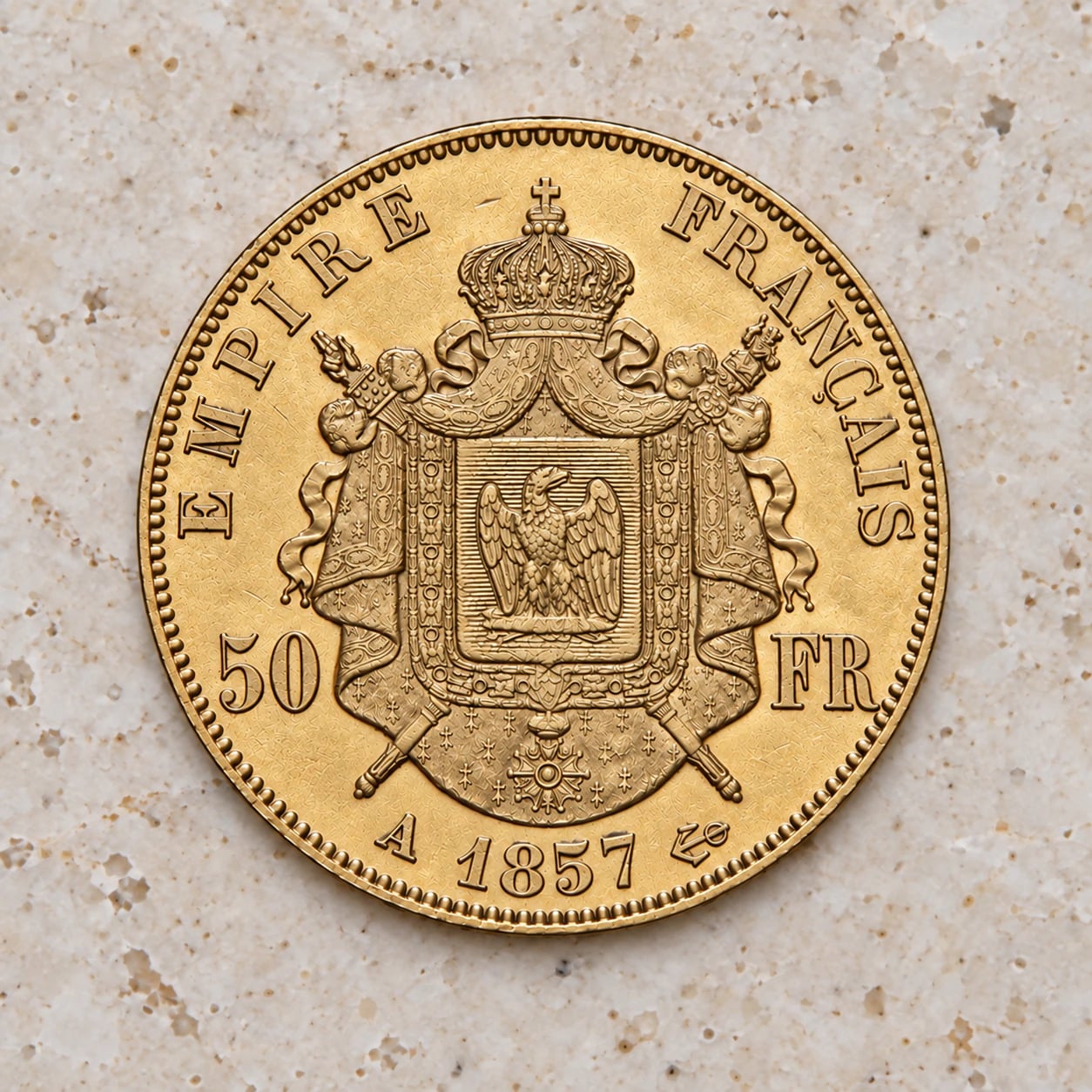 A complete large 1857 French 50 Franc Napoleon III gold coin