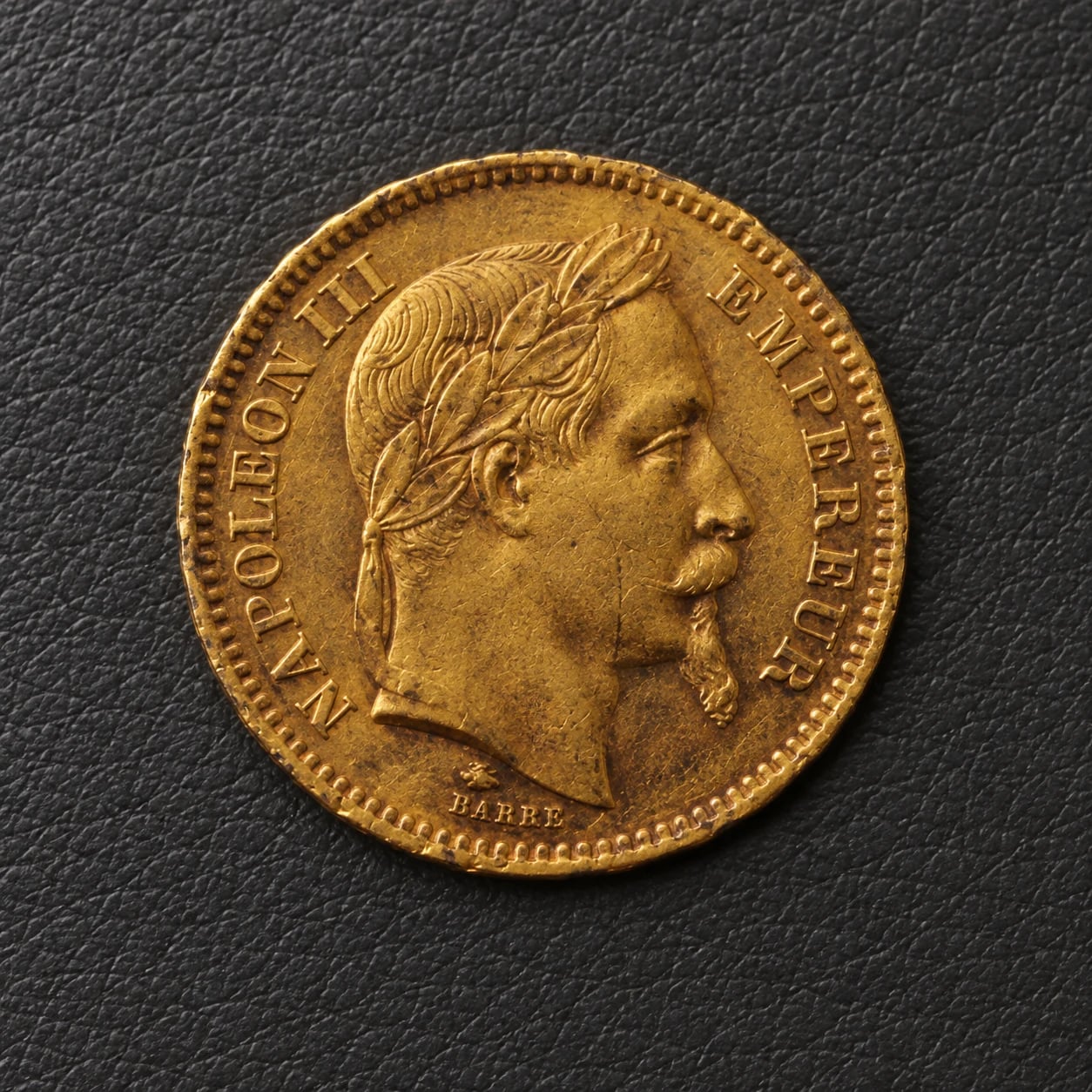 A complete worn 1863 French 20 Franc Napoleon III gold coin