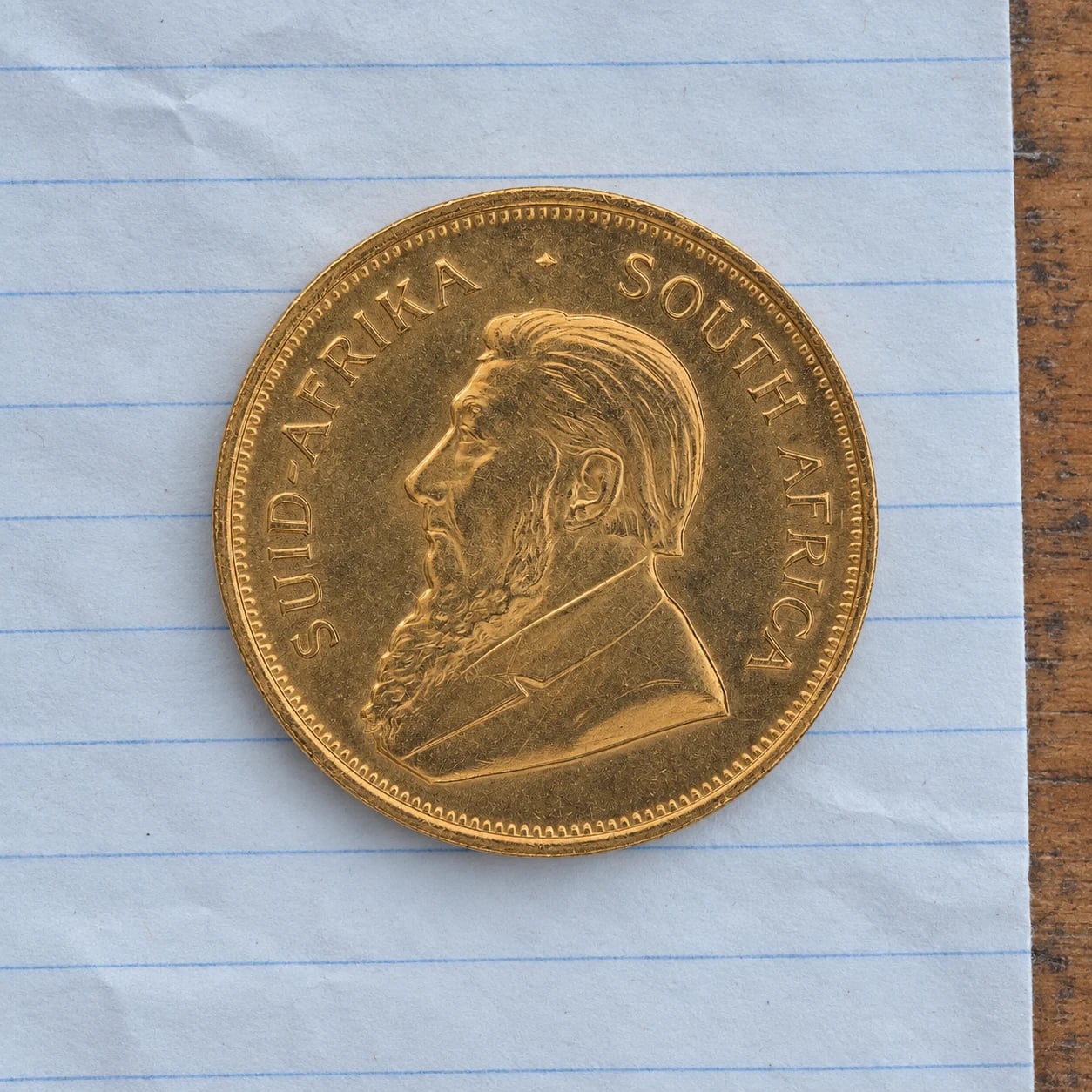The complete Paul Kruger portrait side of a 1975 Gold Krugerrand coin
