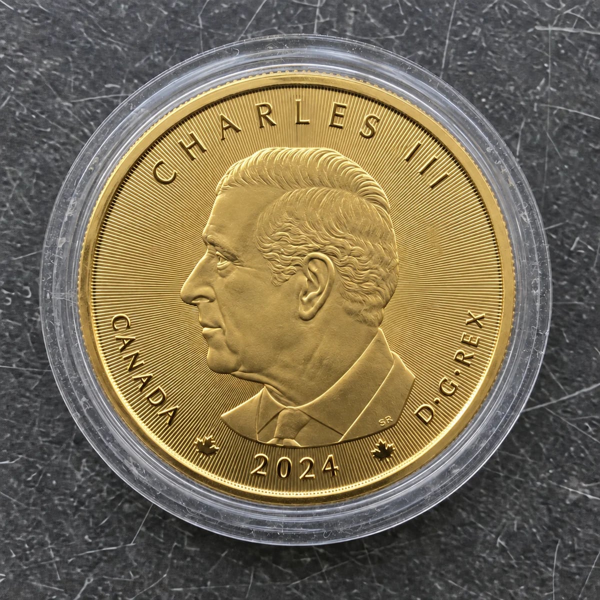 A complete 2024 one-ounce Canadian Gold Maple Leaf coin showing King Charles III