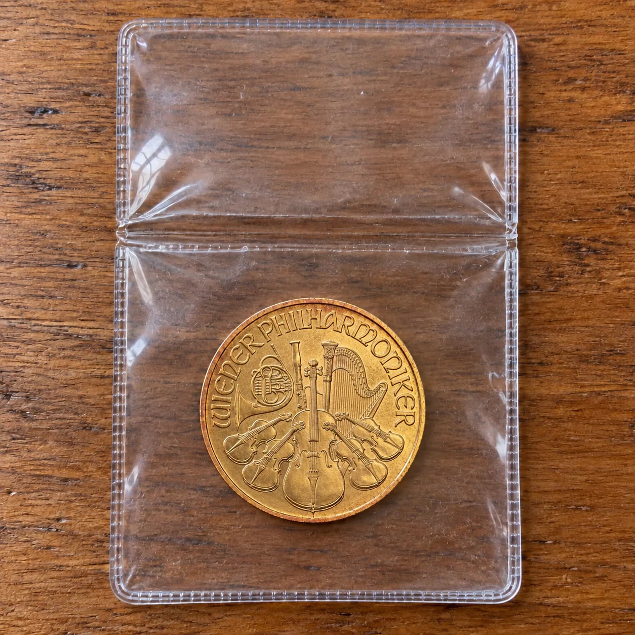 A complete worn 1991 one-tenth-ounce Austrian Gold Philharmonic coin in an open clear flip