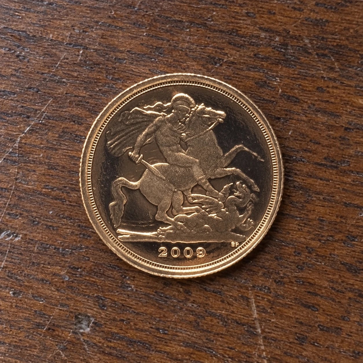 The St George and the dragon reverse of a 2009 Quarter Sovereign coin