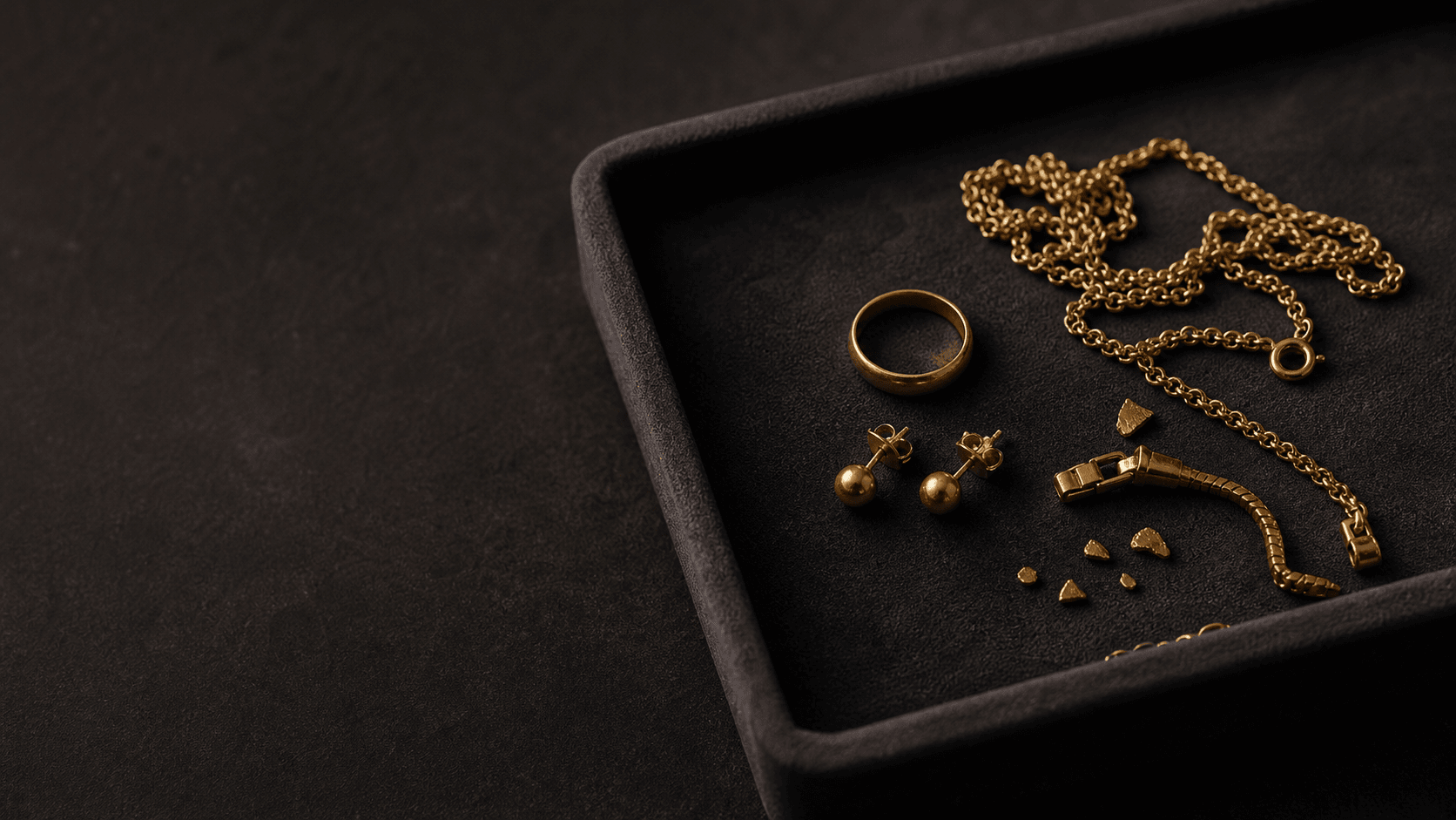 Gold jewellery and small gold fragments prepared for valuation